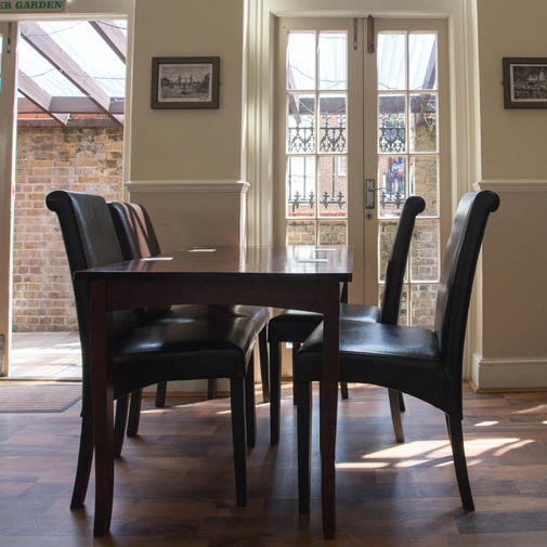 ipic of chairs by the large window